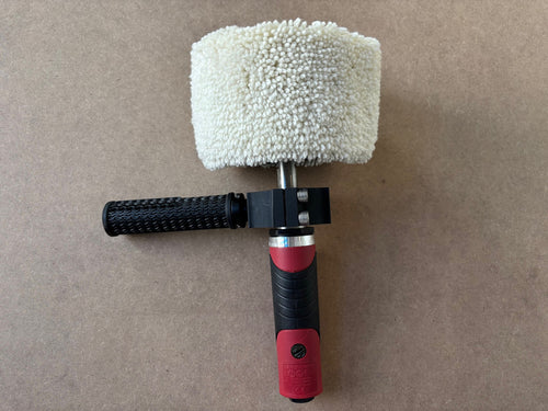 Lucid Aero Compact Drum Buffer front view with wool sleeve installed and Lucid Aero logo on mounting clamp