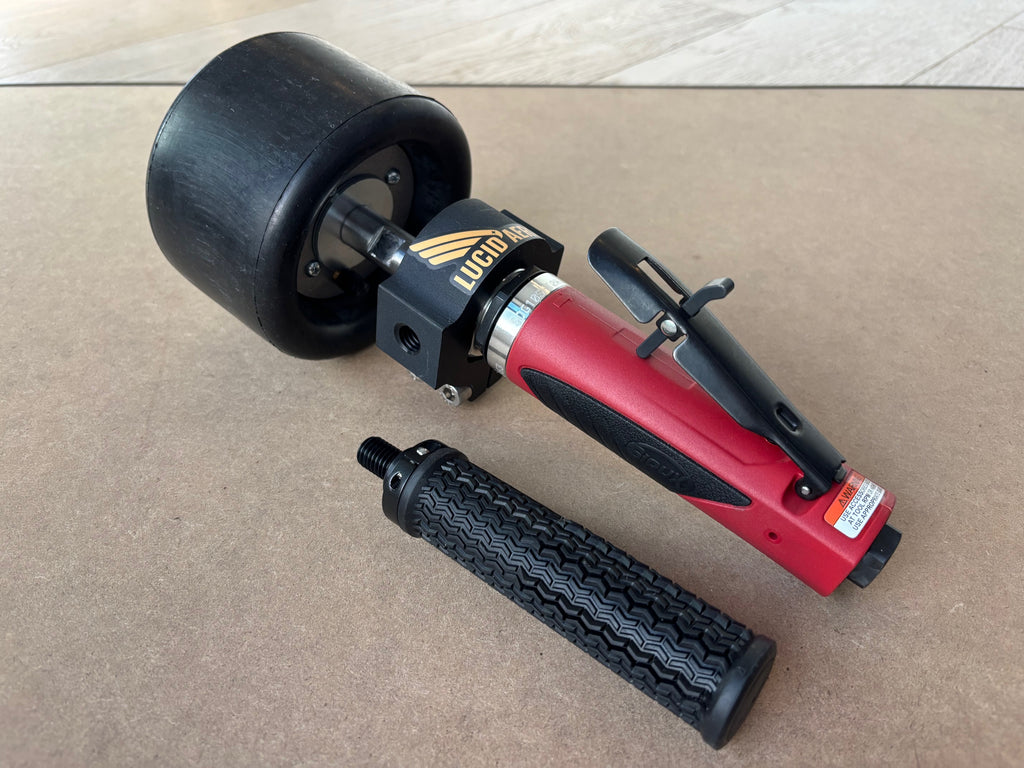 Lucid Aero drum buffer three-quarter view with Lucid Aero logo on clamp block, throttle lever visible, handle removed and laid separately